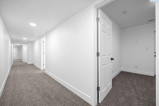 hall with dark carpet