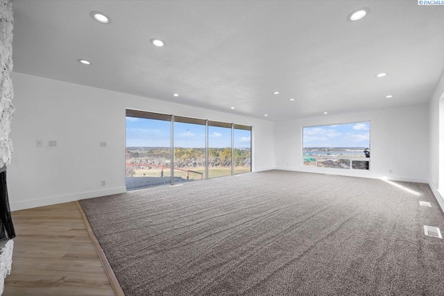 unfurnished living room with a textured ceiling