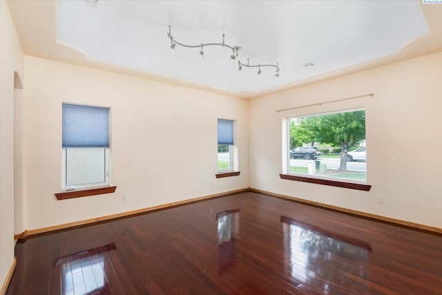 unfurnished room with hardwood / wood-style floors