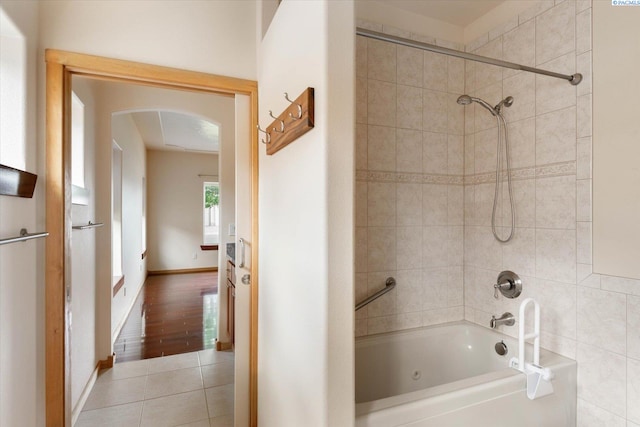 bathroom featuring tiled shower / bath and tile patterned floors