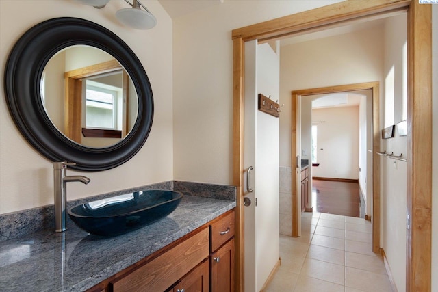 bathroom featuring tile patterned flooring and vanity