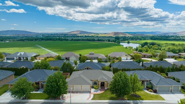 bird's eye view featuring a water and mountain view