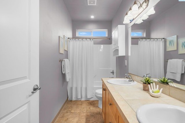 full bathroom featuring vanity, toilet, and shower / bath combo with shower curtain