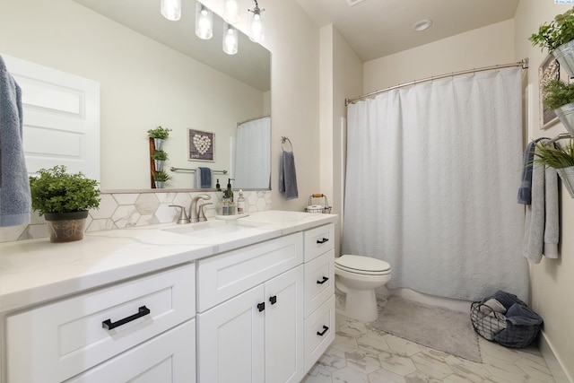 full bathroom with marble finish floor, toilet, decorative backsplash, vanity, and a shower with curtain