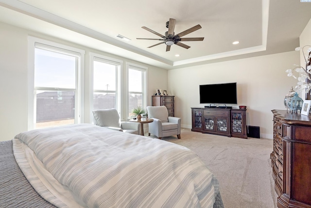 bedroom with a tray ceiling, carpet, recessed lighting, and baseboards