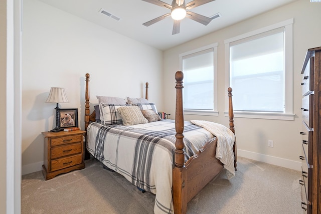 bedroom featuring light colored carpet, visible vents, ceiling fan, and baseboards