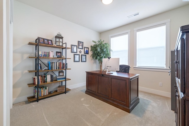 office with light carpet, visible vents, and baseboards