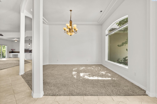 spare room with baseboards, light tile patterned flooring, a notable chandelier, and light colored carpet