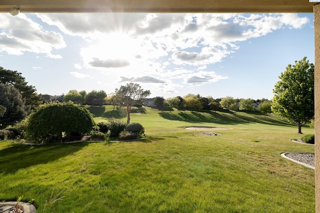 exterior space featuring a yard and golf course view