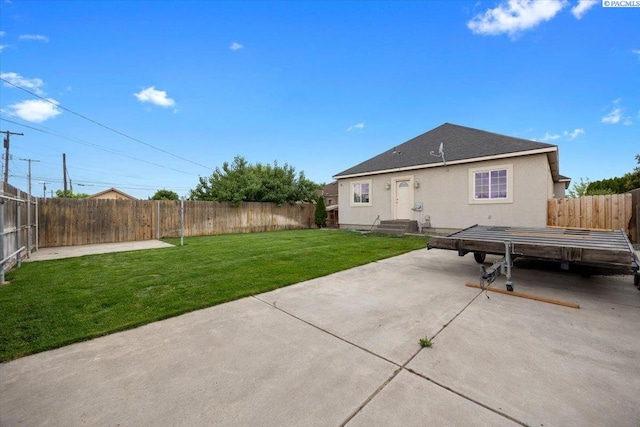 823 S 5th Ave, Pasco, WA 99301 - rear view of house with a patio area, a fenced backyard, and stucco siding
