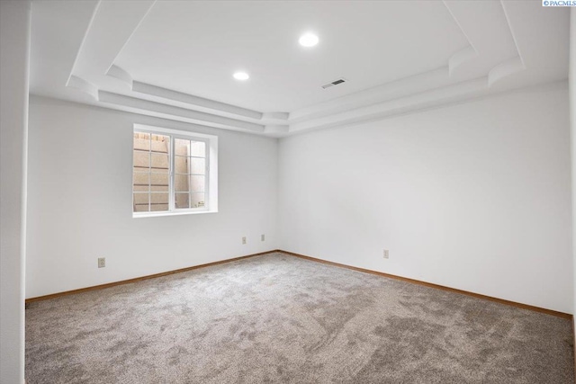 823 S 5th Ave, Pasco, WA 99301 - spare room featuring a tray ceiling, carpet flooring, and recessed lighting