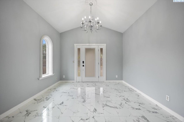823 S 5th Ave, Pasco, WA 99301 - unfurnished room featuring a chandelier, marble finish floors, and vaulted ceiling