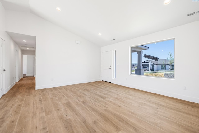 2925 S Osborne St, Kennewick, WA 99338 - unfurnished living room featuring vaulted ceiling, light wood finished floors, recessed lighting, and baseboards