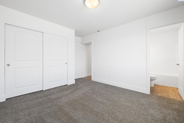 2925 S Osborne St, Kennewick, WA 99338 - unfurnished bedroom with a closet, carpet, connected bathroom, and baseboards