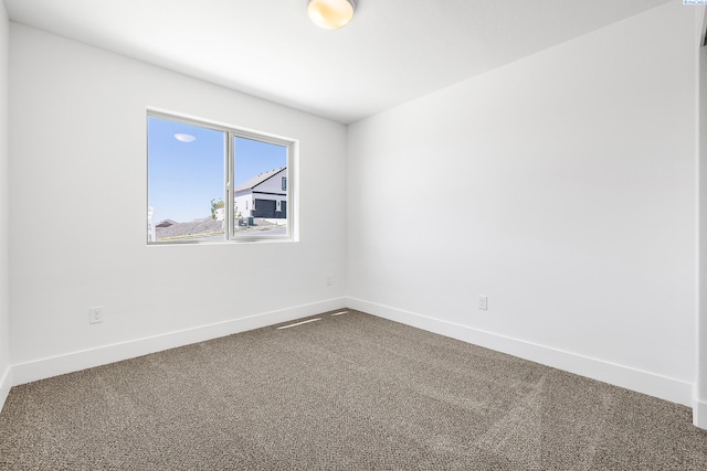 2925 S Osborne St, Kennewick, WA 99338 - unfurnished room featuring dark colored carpet and baseboards