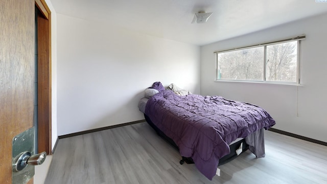 1810 NE Wheatland Dr, Pullman, WA 99163 - bedroom with light wood-style flooring and baseboards