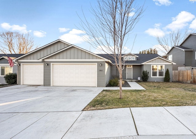 ranch-style home with a garage and a front lawn