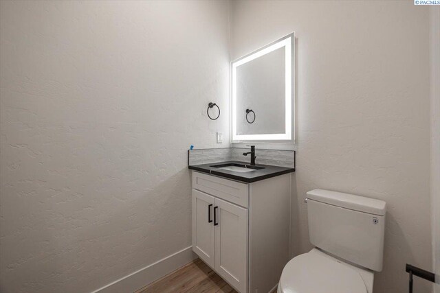 1839 S Union St, Kennewick, WA 99337 - half bath featuring vanity and wood finished floors