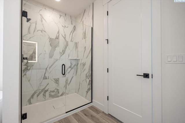 1839 S Union St, Kennewick, WA 99337 - bathroom featuring a marble finish shower and wood finished floors