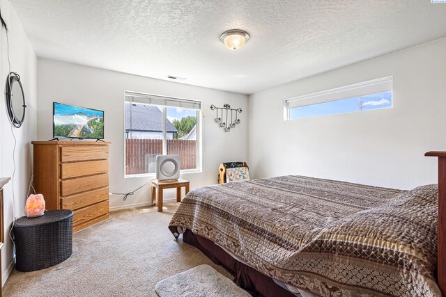 6110 Westport Ln, Pasco, WA 99301 - carpeted bedroom featuring baseboards and a textured ceiling