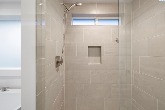 bathroom featuring tiled shower