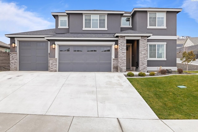 view of front of house with a garage and a front lawn