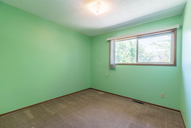 1835 NW Deane St, Pullman, WA 99163 - carpeted empty room featuring a textured ceiling and baseboards