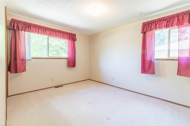 1835 NW Deane St, Pullman, WA 99163 - carpeted spare room featuring baseboards and a textured ceiling