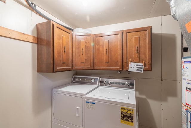 1835 NW Deane St, Pullman, WA 99163 - washroom with cabinet space, washing machine and dryer, and water heater