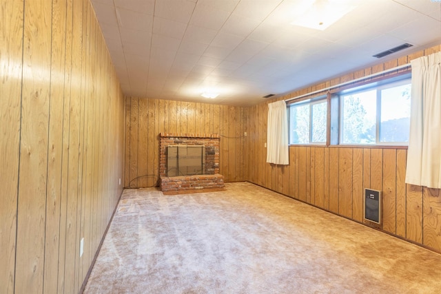 1835 NW Deane St, Pullman, WA 99163 - unfurnished living room with wooden walls, carpet, and a brick fireplace