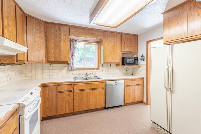 1835 NW Deane St, Pullman, WA 99163 - kitchen featuring white appliances, tasteful backsplash, light countertops, a textured ceiling, and under cabinet range hood