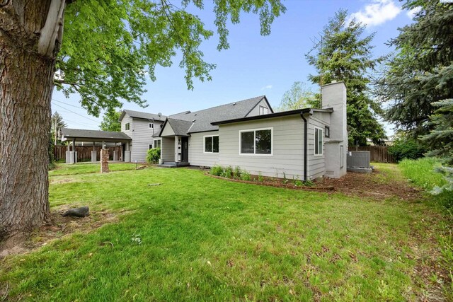 312 Mccabe St, Walla Walla, WA 99362 - rear view of property with a chimney and central air condition unit
