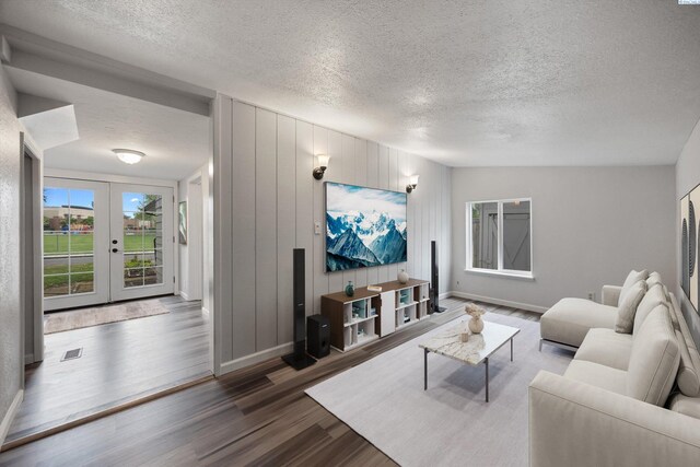312 Mccabe St, Walla Walla, WA 99362 - living area with a textured ceiling, wood finished floors, baseboards, and french doors