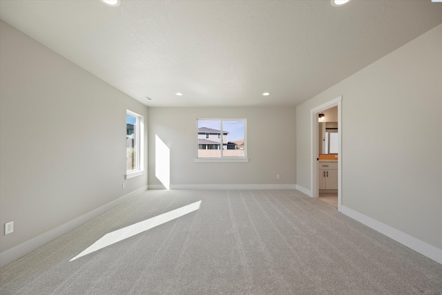 empty room with light colored carpet