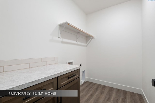 clothes washing area with washer hookup, dark hardwood / wood-style flooring, and electric dryer hookup