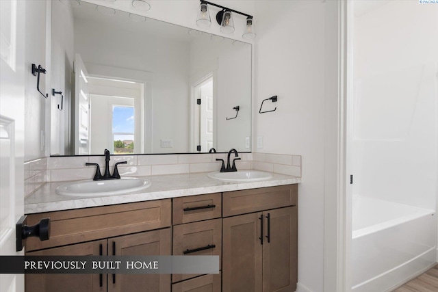 bathroom featuring vanity and a bathing tub