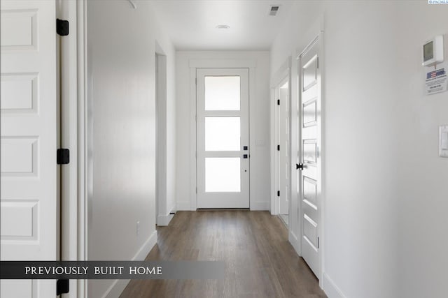 doorway featuring dark hardwood / wood-style floors