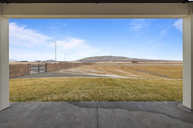 view of yard featuring a mountain view and a rural view