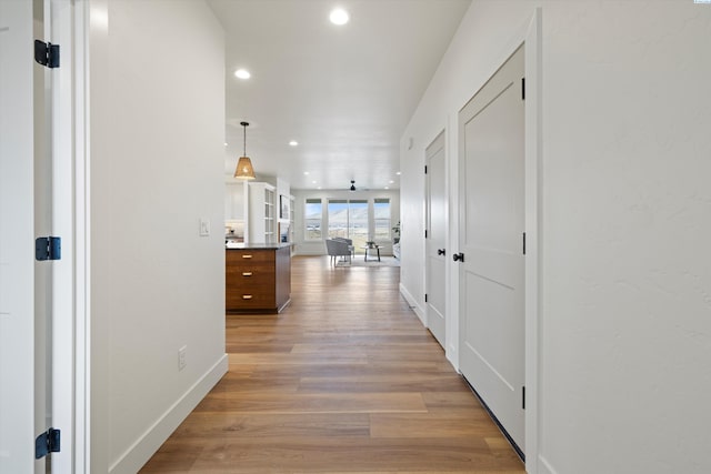 corridor featuring light hardwood / wood-style flooring