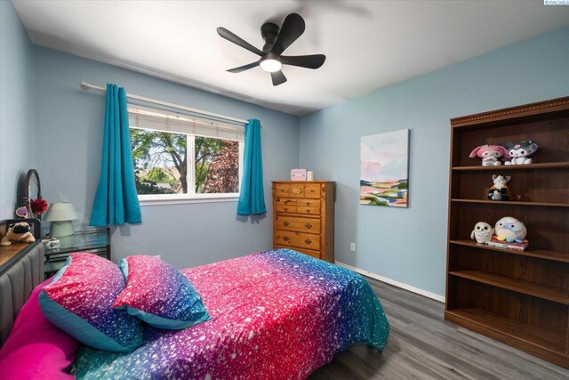 2330 Hummingbird Ln, West Richland, WA 99353 - bedroom featuring wood finished floors and ceiling fan