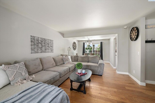 2330 Hummingbird Ln, West Richland, WA 99353 - living room with light wood-style flooring and a chandelier