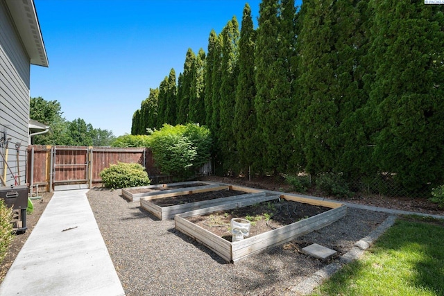 2330 Hummingbird Ln, West Richland, WA 99353 - view of yard with a vegetable garden and a gate