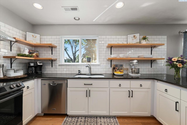 2330 Hummingbird Ln, West Richland, WA 99353 - kitchen featuring dishwasher, black range, open shelves, decorative backsplash, and recessed lighting