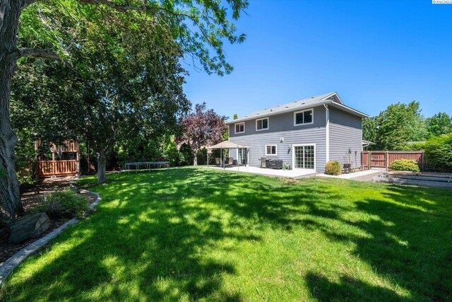 2330 Hummingbird Ln, West Richland, WA 99353 - back of property featuring a patio