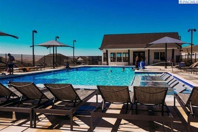 view of swimming pool featuring a patio