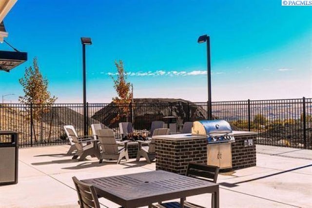 view of patio with a grill and area for grilling