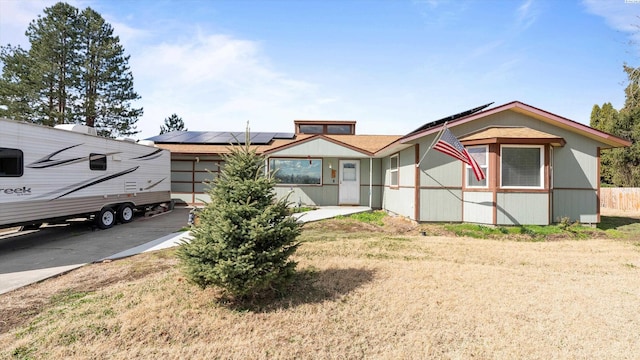 2113 Rainier Ave, Richland, WA 99354 - view of front of property featuring roof mounted solar panels and fence