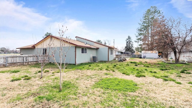 2113 Rainier Ave, Richland, WA 99354 - back of house with an outbuilding, central air condition unit, and fence