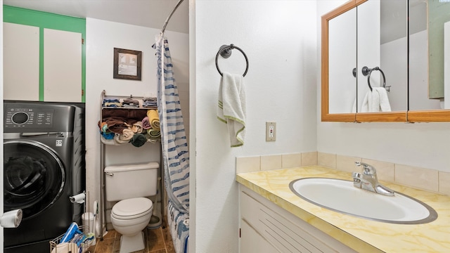 2113 Rainier Ave, Richland, WA 99354 - bathroom with a shower with shower curtain, washer / dryer, toilet, and vanity