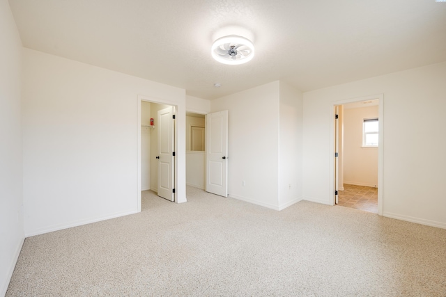 spare room with light colored carpet